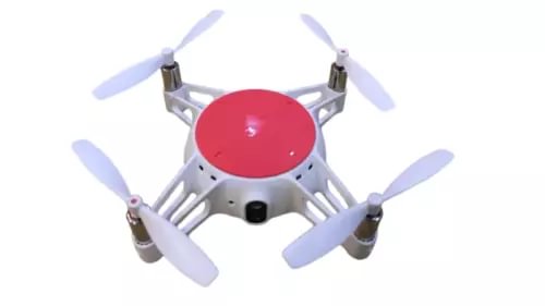 Compact white quadcopter drone with four propellers and red top dome