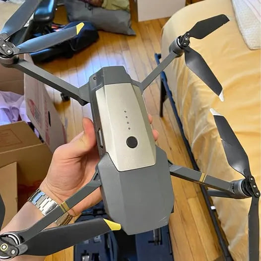DJI Mavic Pro 1 video drone, gray body with four foldable propellers