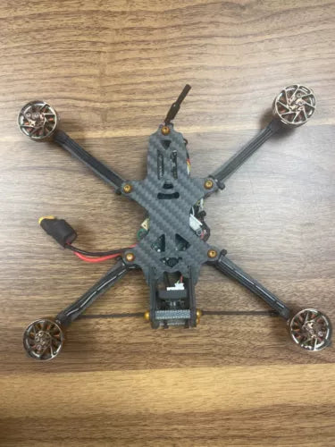 5-inch quadcopter drone with four propellers and carbon fiber frame, top view