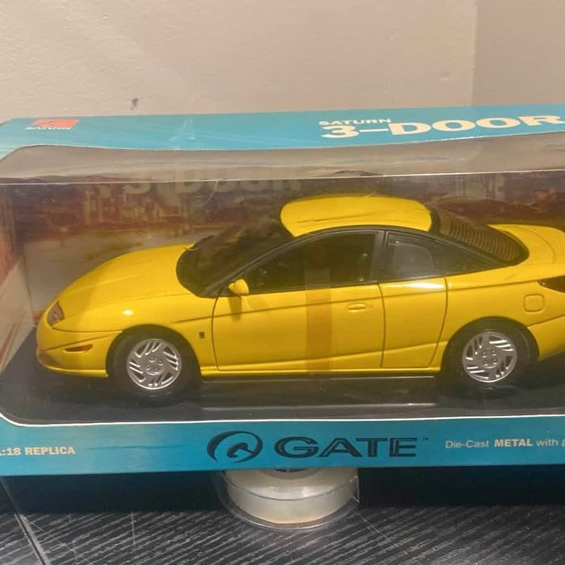 Yellow 1:18 scale diecast sports model car, side view