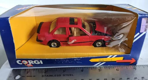 Red diecast BMW E30 M3 sedan model car in box with Corgi logo