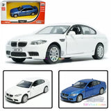 White BMW M5 alloy diecast model car, front three-quarter view, pull-back toy