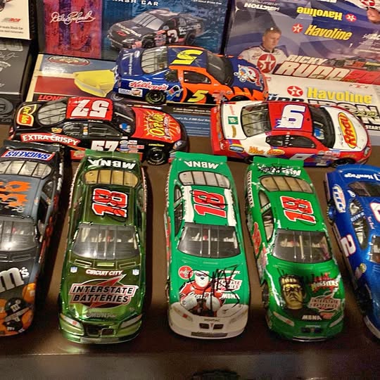 Diecast race car model collection with number decals and team logos