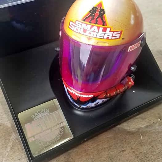 Diecast racing helmet with purple tinted visor and red accents