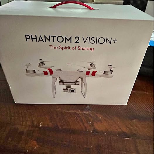 DJI Phantom 2 Vision+ drone box with red-and-white drone illustration