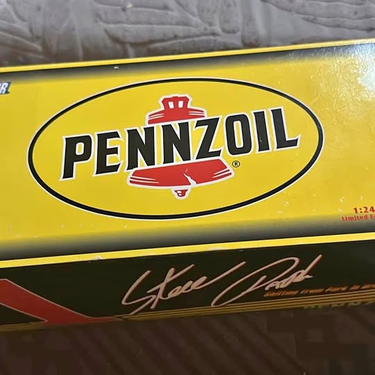 Yellow diecast car hood with PenzOil logo and Steve Van signature