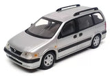 Silver diecast station wagon model with black wheels and roof rack detail