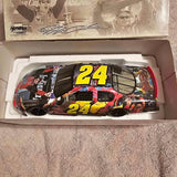 Diecast race car model with bold yellow number 24 on black and red body