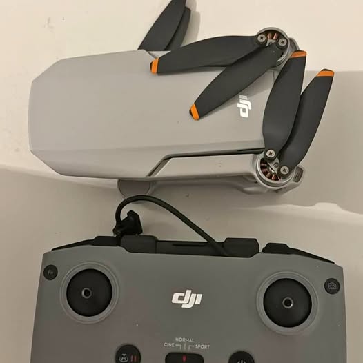 Dji Mini 2 drone with folded propellers, front camera lenses and dji logo