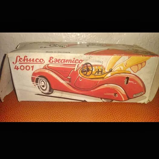 Schuco Examico 4001 vintage diecast car model in red and yellow box