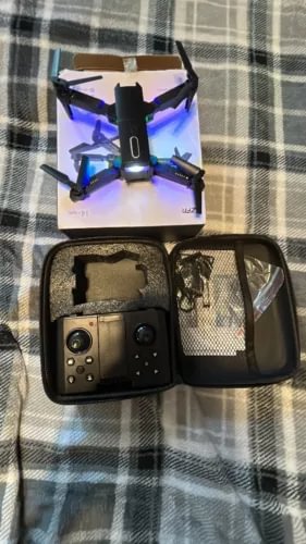 Quadcopter drone with dual HD cameras, blue LED lights, with open carrying case