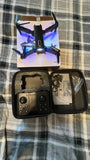 Quadcopter drone with dual HD cameras, blue LED lights, with open carrying case