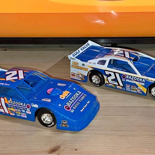 Blue diecast race car with white roof, number 21 on the side