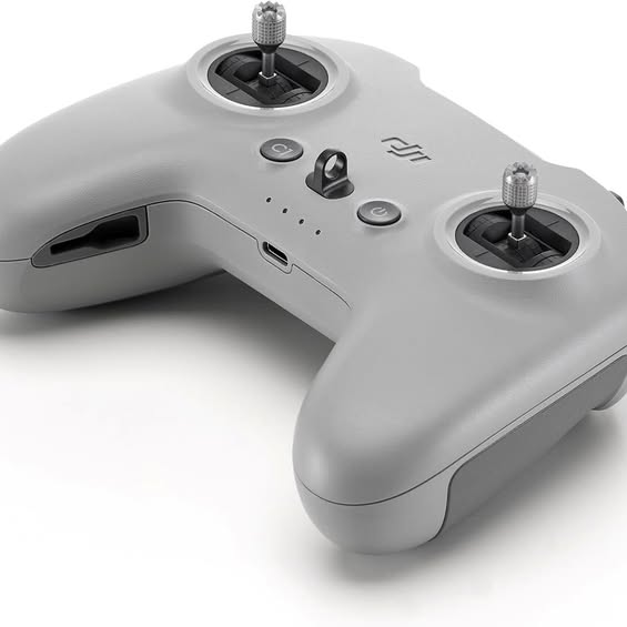 Remote controller with dual thumbsticks, buttons, and side ports, light gray