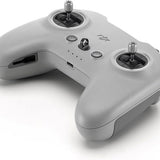 Remote controller with dual thumbsticks, buttons, and side ports, light gray