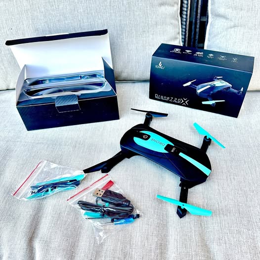 Foldable pocket camera drone with Wi‑Fi, blue body and teal propellers