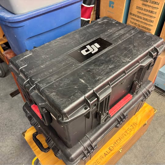 DJI drone hard transport case with handle and DJI logo on lid