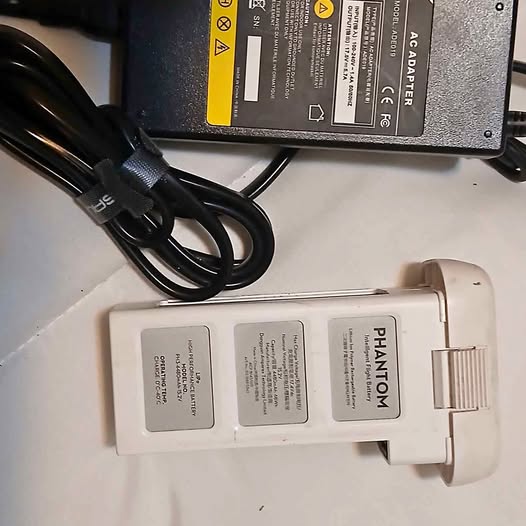 DJI Phantom 3 power adapter with connected cable and connector plug