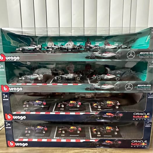 Formula 1 diecast car display set in retail boxes with multiple team cars