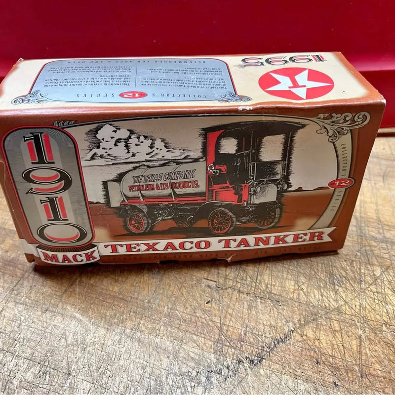 Diecast tanker truck toy in retail box with Mack and Texaco graphics