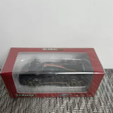 1:64 scale diecast car in red display box with clear window