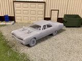 Miniature gray 3D printed demolition derby car with open roll bars, side view.