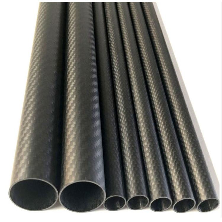 Dark 3K carbon fiber barrel tubes, round hollow cylinders with visible ends