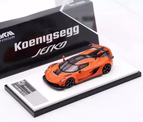 Orange Koenigsegg Jesko 1:64 diecast sports car model on display base