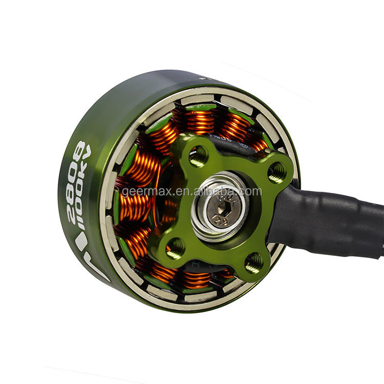 Green BLDC drone motor with exposed copper windings, mounting holes, and center shaft