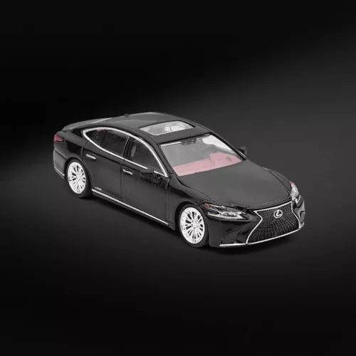 Black luxury sedan diecast model car, front 3/4 view, metal finish, L emblem