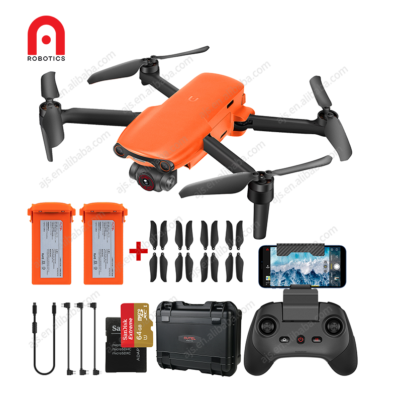 Orange and black quadcopter drone with remote controller and spare accessories