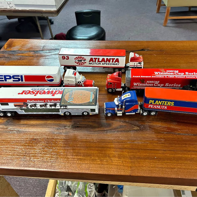 Diecast race truck set with red, blue, and white trucks