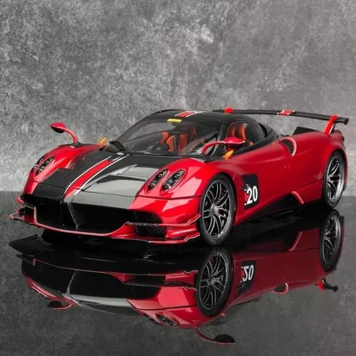 Red and black alloy sports diecast car model, front 3/4 view with racing decals