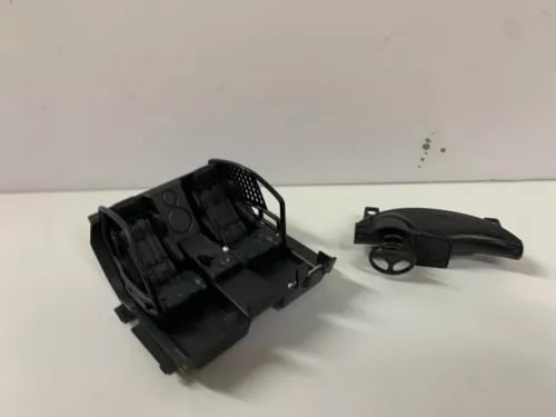 1:24 scale black bucket seats and dashboard parts, detail view