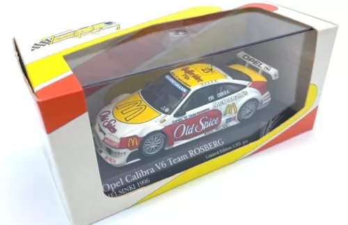 1:43 Opel Calibra diecast racing car model in yellow, white, and red