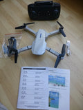 Foldable quadcopter drone with camera and instruction sheet and controller