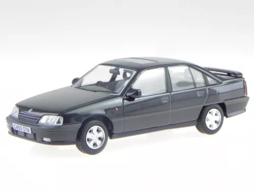 Dark gray diecast model car, front and side view, detailed wheels and grille