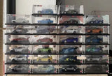 Acrylic display case with multiple Hot Wheels 1:64 diecast cars, clear shelves