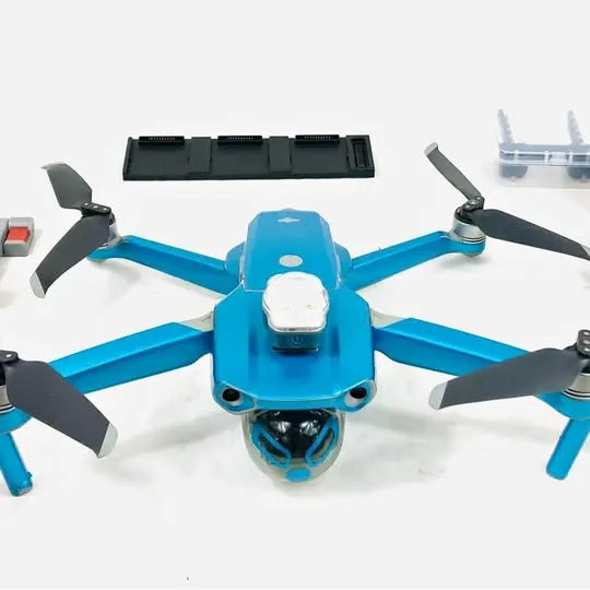 Blue quadcopter drone with camera module and four propellers