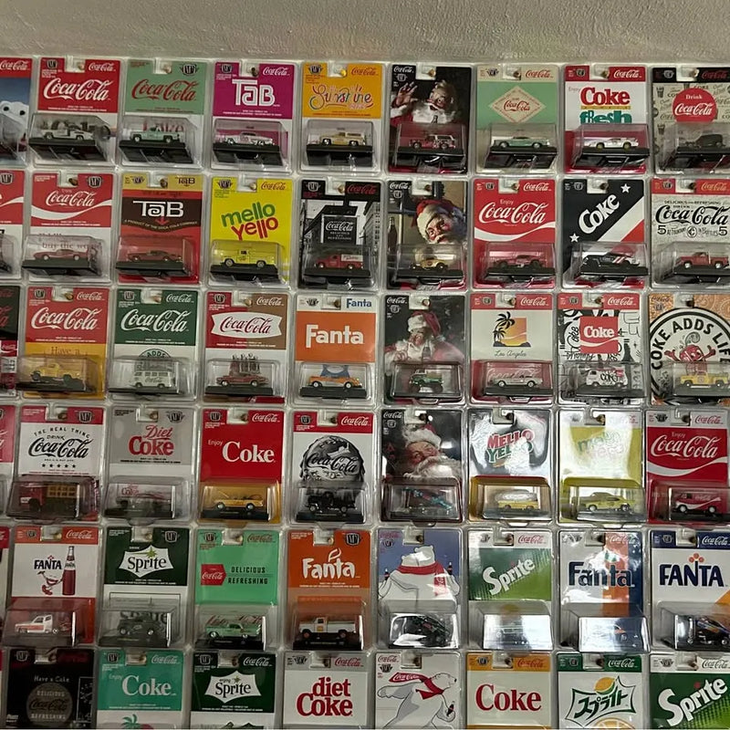 Coca-Cola diecast car set in individual display boxes, mixed colors and models