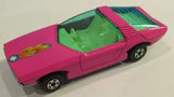 Pink diecast model car with green interior, side and top view, detailed wheels