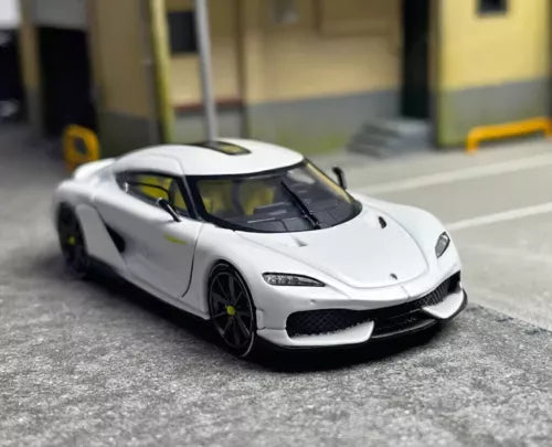 White diecast sports model car with open grille, front 3/4 view