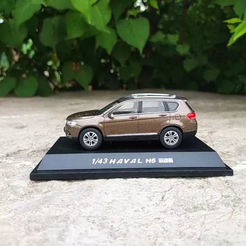 Diecast SUV model with stand, brown Haval H6, 1/43 scale, side view.