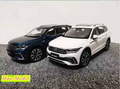 Diecast model car set, blue and white SUV with detailed front grille and headlights