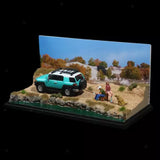 1/64 scale desert diorama with turquoise pickup and two figures