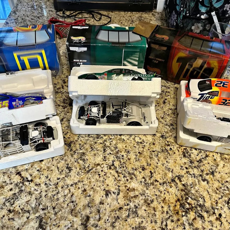Diecast NASCAR stock car model, open white hood with engine and details