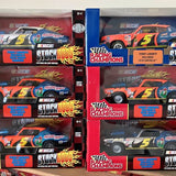 NASCAR 1/18 diecast race car in box, orange #5 with flames
