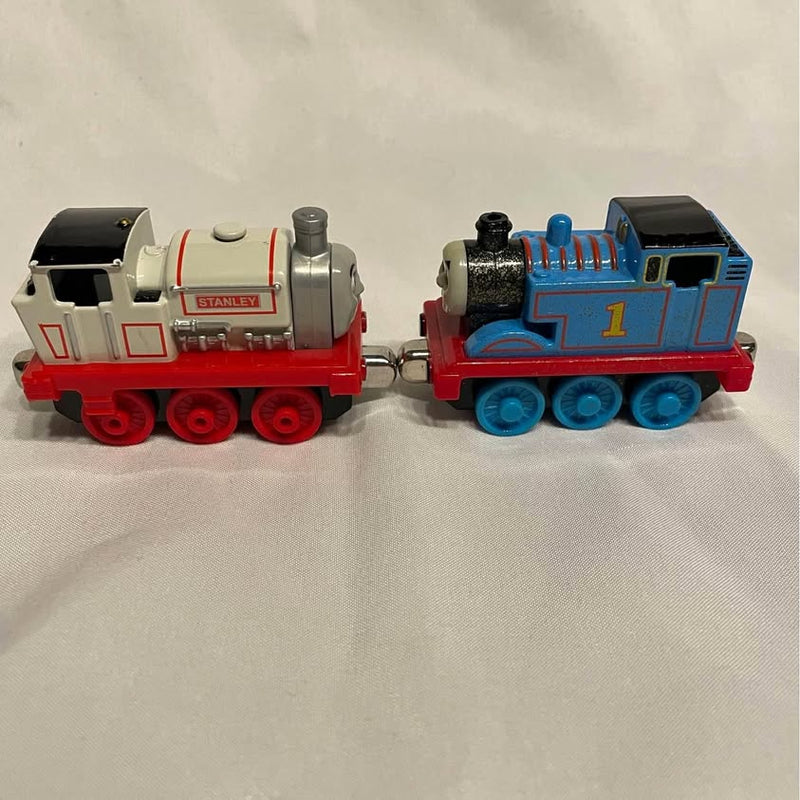Thomas and Friends diecast trains: blue engine #1 and gray tanker car, coupled