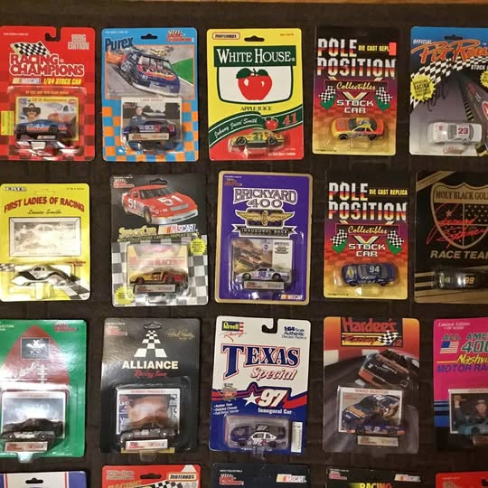 Assorted 1/64 scale NASCAR diecast cars in blister packs, multiple teams visible