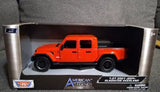 Motor Max 1:24 scale diecast pickup truck model, orange red, in display box